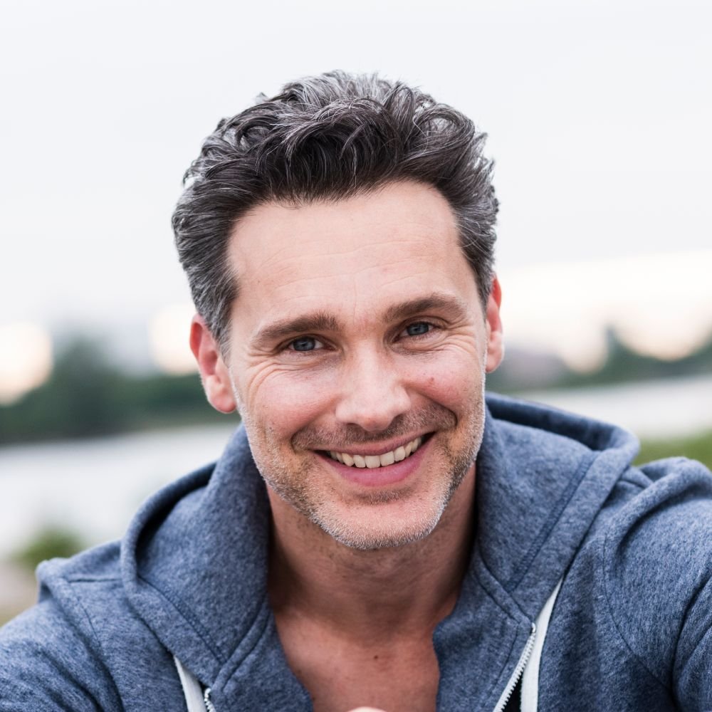 portrait of smiling man at the riverside b6w5ehb 1 1.jpg