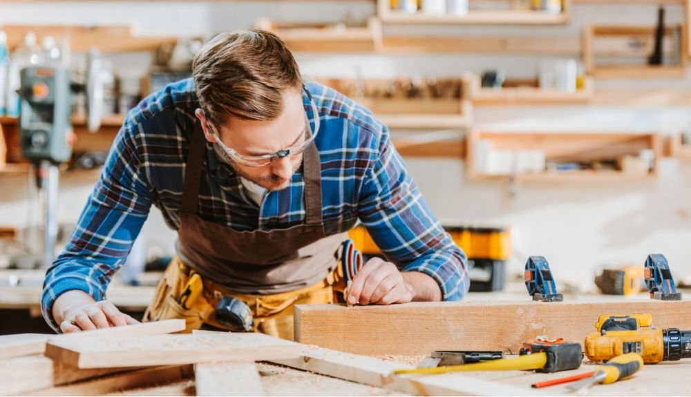 selective focus of woodworker in goggles touching b4aj58u 1.jpg