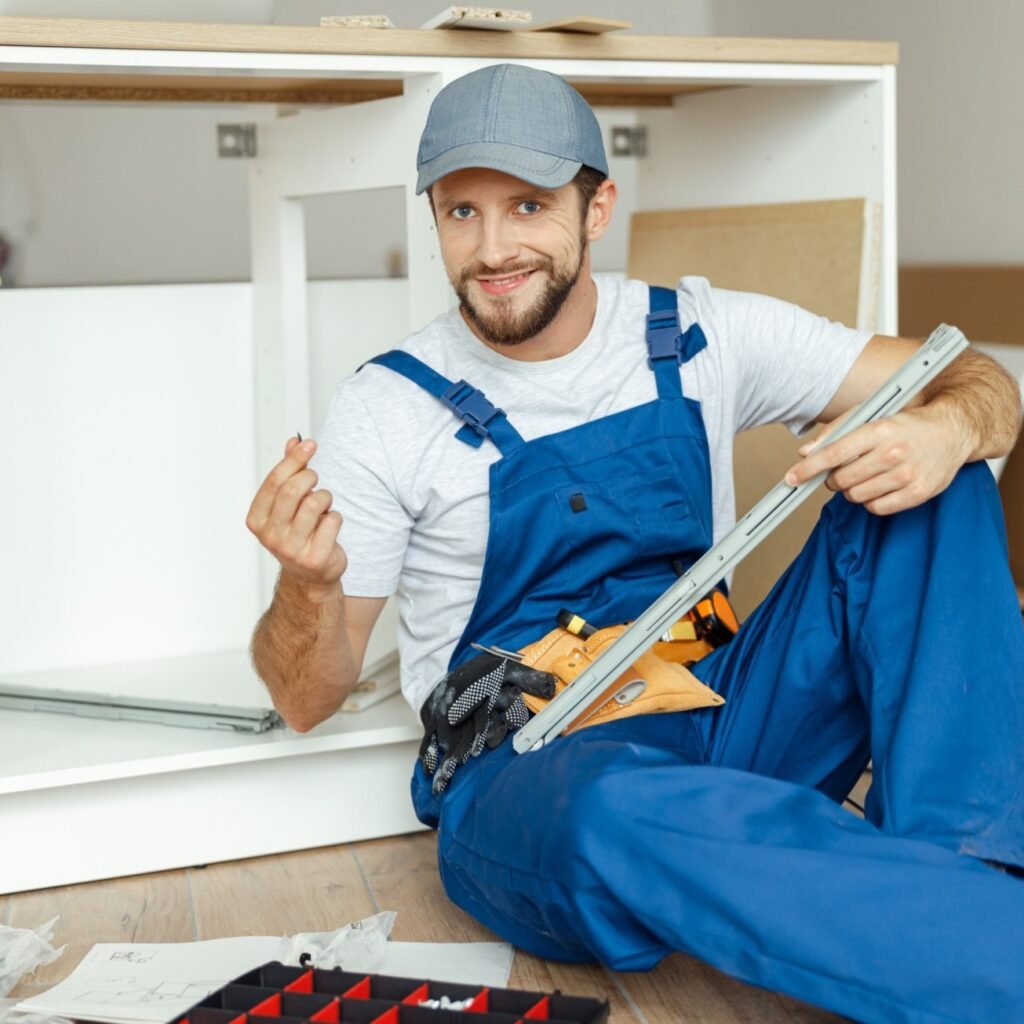 smiling handyman kitchen carpenter worker in overa ank9.jpg